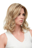 Woman with hair fall showing her Kendall wig with a lace front and single monofilament cap 