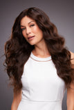 Woman with hair loss wearing a long wavy Remy human hair Kim wig from Fascinations 