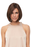 Woman with Alopecia covering her head in the brunette Kristi synthetic wig from Fascinations 