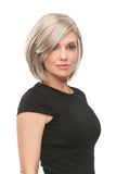 Young woman with thinning hair wearing the Kristi wig 