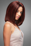 Female with hair fall is covering her head with a human hair wig by Jon Renau called Carrie 