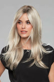 Lady with advanced stage hair loss showing her long synthetic Laura wig in shade FS17/101s18