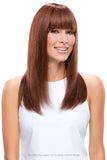 Happy woman with thinning hair showing her Lea long length wig with bangs and a hand tied cap