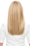 Woman with alopecia showing the back of her long blonde Lea Remy human hair wig 