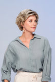 Model with progressive hair loss showing the short layered wavy Lily Petite wig from Fascinations