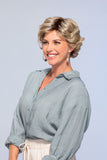 Happy woman with hair fall wearing a Lily petite wig in the shade 22F16 from the O'solite collection