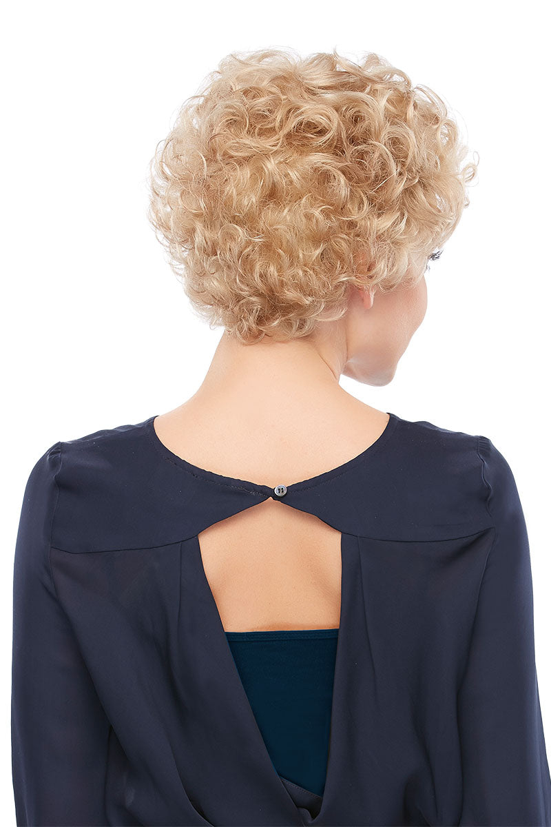 Woman with progressive hair loss showing the back of her short blonde Lily wig 