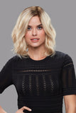 Woman with fine hair covering her head with the Lucy Short Lightweight Wig