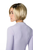 Lady with progressive hair loss showing her blonde synthetic Maisie wig 