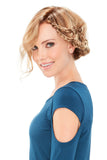 Woman with hair loss showing her Mila Petite wig in an up style 