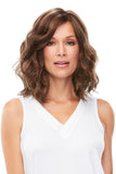 Female with hair loss showing her shoulder length wavy synthetic Mila wig by Jon Renau 