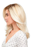 Young woman with progressive hair loss showing her light blonde synthetic Miranda wig 