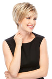 Smiling woman with Alopecia covering her head with her short style Natalie wig 