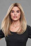 Young woman with hair loss wearing a long sleek blonde Penelope human hair wig by Jon Renau 
