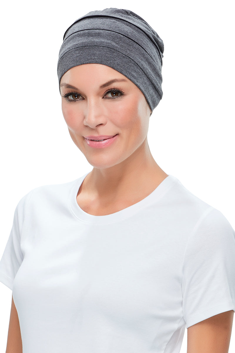 Woman with hair loss wearing her grey Playful Softie headwear 