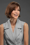 Happy woman with balding showing her brunette chin-length bob style Positano wig from Fascinations 