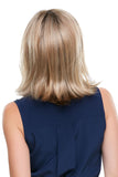 Female with hair fall showing the back of her shoulder length Rosie wig 