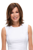Lady with hair loss wearing a brunette bob style Rosie wig with side-swept bangs 