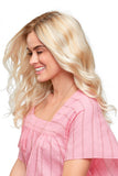 Laughing woman with advanced stage hair loss wearing her light blonde Sarah wig from Fascinations 