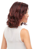 Female with balding covering her head with her shoulder length wavy synthetic Scarlett Petite wig 