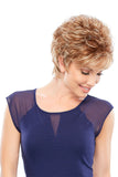 Happy woman with progressive hair loss wearing a short style Sheena Petite wig in the O'solite range
