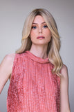 Woman wearing the medium length remy human hair Sienna wig in Blonde