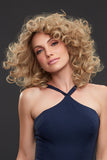 Female with hair fall showing her Sienna human hair wig with smartlace technology styled with curls 