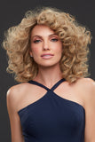 Model with Alopecia wearing a curly styled Sienna human hair wig in a blonde shade 