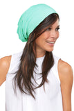 Happy woman with hair fall covering her head with her comfortable Softie Boho Beanie 