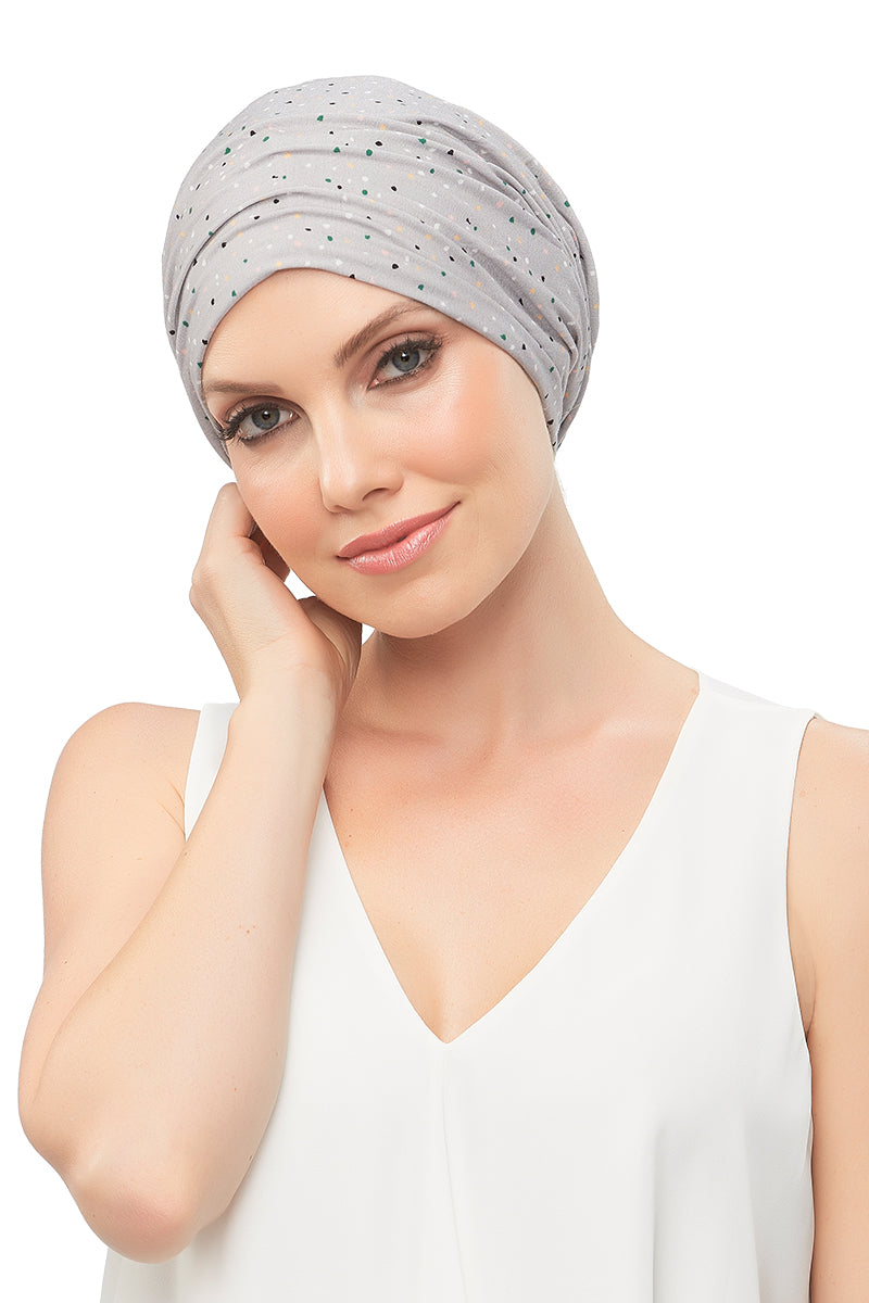 Woman with hair fall covering her head with a Softie Boho Beanie by Jon Renau 