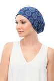 Female with complete hair loss is covering hear head with her Softie Boho Beanie in a blue colour 