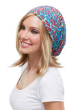 Smiling woman with Alopecia wearing a multi colour Softie Boho Beanie from Fascinations 