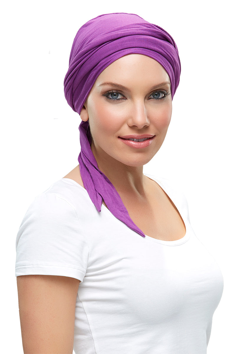 Model with hair loss wearing a purple Softie Wrap 