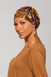 Woman with Complete hair loss wearing a leopard print The Softie Print by Jon Renau