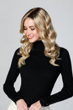 Smiling woman with fine hair wearing her wavy blonde synthetic Top Coverage 18" Topper by Jon Renau