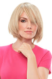 Woman with light blonde hair wearing a Top This 8 Inch Remy Human Hair Topper to add volume 