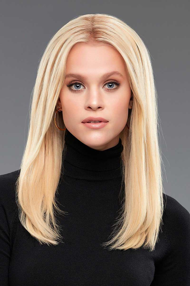 Lady wearing blonde clip in hair extensions that measure 16 inches long by 4 inches wide