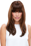Woman with long brown hair is adding the Easifringe Human hair topper to create bangs 