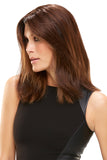 Woman with fine brunette hair wearing the Easipart Heat Defiant 18 Inch Topper by Jon Renau 