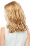 Woman with hair loss wearing a below the shoulder length Heidi wig 